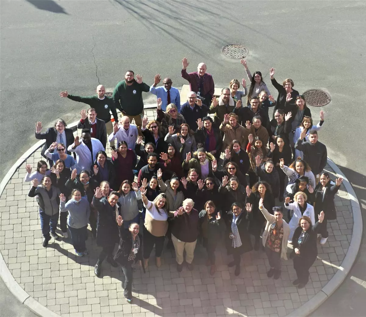 CIFC Health staff standing and waving